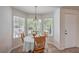 Cozy breakfast nook with natural light, seating for four, and easy access to the entryway at 8800 Crescent Ridge Ln, Las Vegas, NV 89134