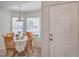 Bright breakfast nook featuring sunlight through windows and seating for four at 8800 Crescent Ridge Ln, Las Vegas, NV 89134