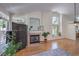 A cozy living room with natural lighting and a fireplace at 8800 Crescent Ridge Ln, Las Vegas, NV 89134
