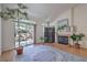 Cozy living room with a fireplace, sliding glass doors, and natural lighting at 8800 Crescent Ridge Ln, Las Vegas, NV 89134