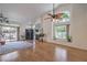 Airy living room with natural light, hardwood floors, and a cozy fireplace at 8800 Crescent Ridge Ln, Las Vegas, NV 89134