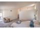 Bright and spacious primary bedroom boasts lots of natural light and a cozy seating area at 8800 Crescent Ridge Ln, Las Vegas, NV 89134