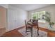Comfortable office space with antique desk, chair and natural light at 8800 Crescent Ridge Ln, Las Vegas, NV 89134