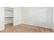 A bedroom with neutral carpet and an open door to a closet with shelving at 8805 Jeffreys St # 1003, Las Vegas, NV 89123
