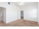 A bedroom featuring neutral carpet, white walls, and a ceiling fan at 8805 Jeffreys St # 1003, Las Vegas, NV 89123