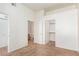 A bedroom with neutral carpet, white walls, and doors to a closet and bathroom at 8805 Jeffreys St # 1003, Las Vegas, NV 89123