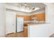Bright, open kitchen features sleek, oak cabinets and lots of natural light at 8805 Jeffreys St # 1003, Las Vegas, NV 89123