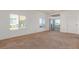Spacious living room with a neutral carpet, and bright, natural lighting at 8805 Jeffreys St # 1003, Las Vegas, NV 89123