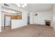 A well-lit living room features an open layout with a fireplace, kitchen, and front door at 8805 Jeffreys St # 1003, Las Vegas, NV 89123