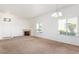 A large living room features a fireplace, tile entry, and neutral carpet at 8805 Jeffreys St # 1003, Las Vegas, NV 89123