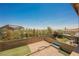 Wide aerial view of an outdoor living space with patio, seating and landscaping in a private backyard at 920 Cirrus Cloud Ave, Las Vegas, NV 89138