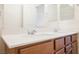 Bathroom vanity featuring dual sinks, modern fixtures, and a large mirror at 920 Cirrus Cloud Ave, Las Vegas, NV 89138
