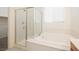 The bathroom features a tub and glass shower at 920 Cirrus Cloud Ave, Las Vegas, NV 89138