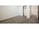 Comfortable bedroom featuring soft carpeting and a closet with sliding doors at 920 Cirrus Cloud Ave, Las Vegas, NV 89138