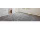 Spacious bedroom with carpet, an ensuite bathroom, and a door to an outdoor area at 920 Cirrus Cloud Ave, Las Vegas, NV 89138