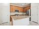 Modern kitchen featuring granite countertops, stainless steel appliances, and wood cabinetry at 920 Cirrus Cloud Ave, Las Vegas, NV 89138