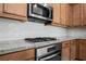 A closer view of the kitchen, with modern appliances and granite countertops at 920 Cirrus Cloud Ave, Las Vegas, NV 89138