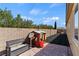 This backyard is equipped with a playset, bench, and pavers at 9240 Northfield Park Ct, Las Vegas, NV 89148