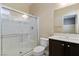 Bathroom featuring a glass-enclosed shower, vanity and white toilet at 9240 Northfield Park Ct, Las Vegas, NV 89148
