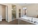 This primary bathroom boasts a soaking tub and glass enclosed shower at 9240 Northfield Park Ct, Las Vegas, NV 89148