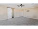 Bedroom with tiled floor, a ceiling fan, barn door and closet featuring modern fixtures at 9240 Northfield Park Ct, Las Vegas, NV 89148