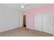 Neutral bedroom featuring soft carpet floors and a double door closet at 9240 Northfield Park Ct, Las Vegas, NV 89148
