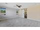 Bedroom features tiled flooring, ceiling fan, and modern barn door, providing an open, airy feel at 9240 Northfield Park Ct, Las Vegas, NV 89148