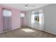 Neutral bedroom featuring soft carpet floors and bright natural light at 9240 Northfield Park Ct, Las Vegas, NV 89148