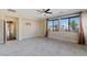 Bedroom showcases tiled flooring, a ceiling fan, and two large windows offering a bright airy feel at 9240 Northfield Park Ct, Las Vegas, NV 89148