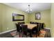 Stylish dining room featuring a modern chandelier, and a neutral color scheme at 9240 Northfield Park Ct, Las Vegas, NV 89148