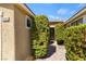 Pathway leads to a front door with a charming landscaped entrance at 9240 Northfield Park Ct, Las Vegas, NV 89148
