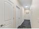 Hallway with wood-look floors, white walls and recessed lighting, creating a seamless transition at 9240 Northfield Park Ct, Las Vegas, NV 89148