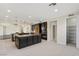 Bright, open kitchen featuring stainless appliances, dark cabinetry, and a walk-in pantry at 9240 Northfield Park Ct, Las Vegas, NV 89148