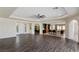 Spacious living room featuring an open floor plan, recessed lighting, and dark wood floors at 9240 Northfield Park Ct, Las Vegas, NV 89148