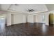 Spacious living room featuring an open floor plan, recessed lighting, and dark wood floors at 9240 Northfield Park Ct, Las Vegas, NV 89148