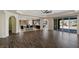 Spacious living room featuring an open floor plan, recessed lighting, and dark wood floors at 9240 Northfield Park Ct, Las Vegas, NV 89148