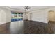 Expansive living room with dark wood floors and backyard view at 9240 Northfield Park Ct, Las Vegas, NV 89148