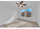 Bedroom with a ceiling fan and windows with a view of a neighboring house at 9315 Indian Corn Ct # 101, Las Vegas, NV 89178