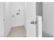 Well-lit laundry room with hookups, neutral paint and modern flooring at 9315 Indian Corn Ct # 101, Las Vegas, NV 89178