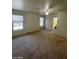 Bedroom with two windows, a ceiling fan, and doorway to the en-suite bathroom at 9617 Pine River Ln, Las Vegas, NV 89123