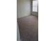 Neutral colored bedroom features carpet, a window, and plenty of natural light at 9617 Pine River Ln, Las Vegas, NV 89123