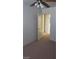 Bedroom featuring neutral walls, plush carpet and an open doorway to bathroom at 9617 Pine River Ln, Las Vegas, NV 89123