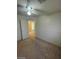 Standard bedroom featuring neutral walls, carpet and a ceiling fan with attached lighting at 9617 Pine River Ln, Las Vegas, NV 89123