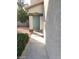 Front entrance showcasing a blue front door, columns, and gravel landscaping at 9617 Pine River Ln, Las Vegas, NV 89123