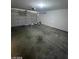 A two-car garage with an automatic door and concrete floor providing secure parking and storage space at 9617 Pine River Ln, Las Vegas, NV 89123