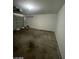 A two-car garage with an automatic door and concrete floor providing secure parking and storage space at 9617 Pine River Ln, Las Vegas, NV 89123