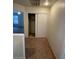 Hallway view showcasing a closet with sliding doors, and neutral carpet flooring at 9617 Pine River Ln, Las Vegas, NV 89123