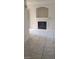 Bright living room features a fireplace with tiled surround, and large, marble-look floor tiles throughout at 9617 Pine River Ln, Las Vegas, NV 89123