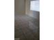 Living room features a large window providing natural light and marble-look floor tiles throughout at 9617 Pine River Ln, Las Vegas, NV 89123