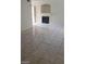Bright living room features a fireplace with tiled surround, and large, marble-look floor tiles throughout at 9617 Pine River Ln, Las Vegas, NV 89123
